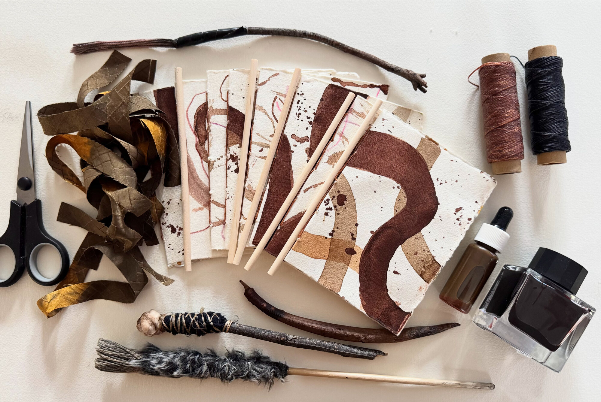 Hand-bound artist book and handmade brush in Lorna Crane studio