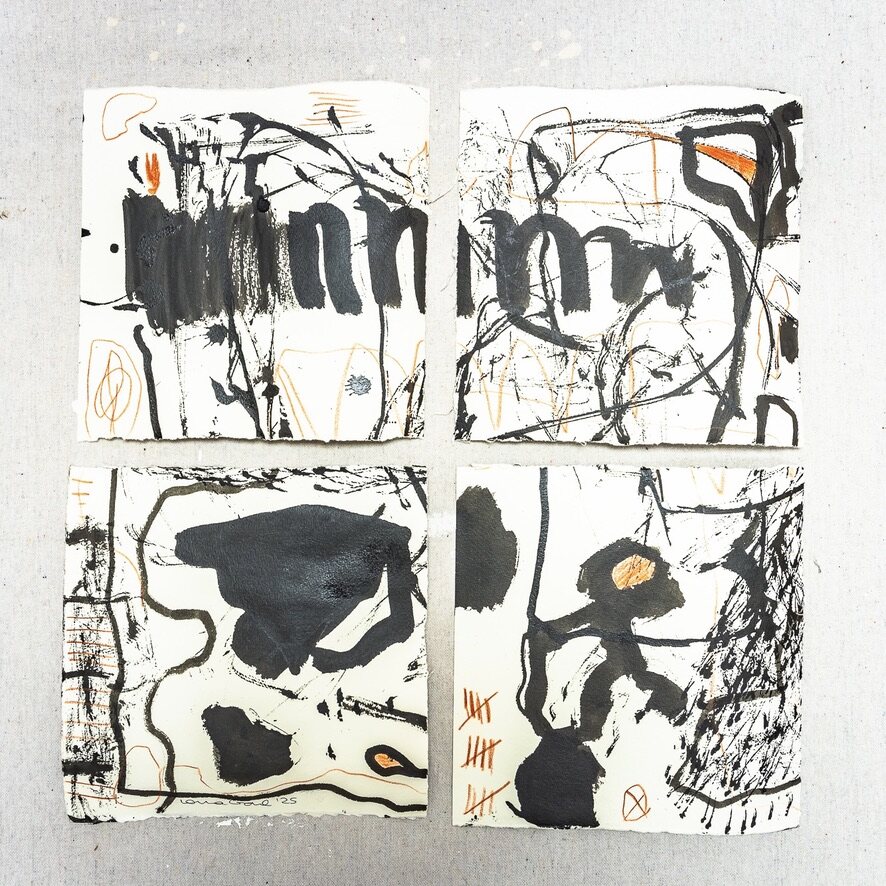 Four-panel ink work photographed on a textured studio surface