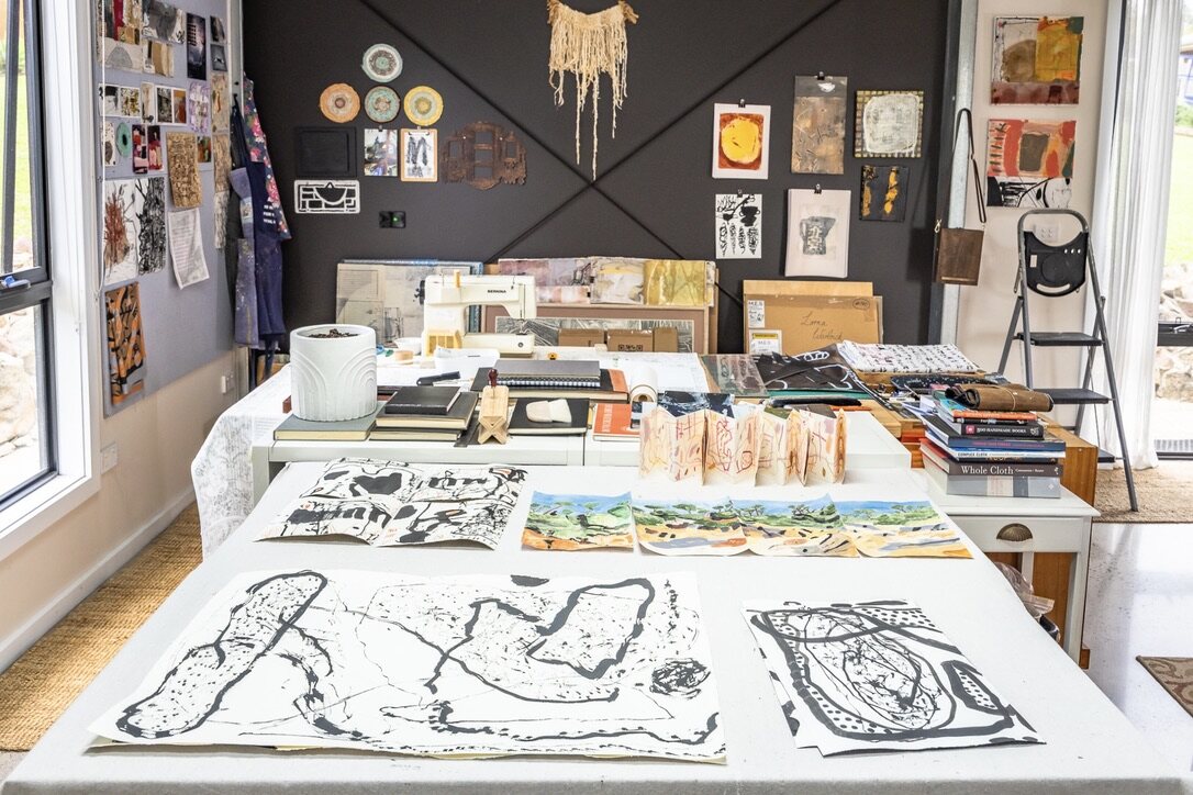Lorna Crane studio table with works on paper and materials
